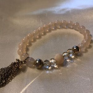 Light beads; stretchy; gold tassel